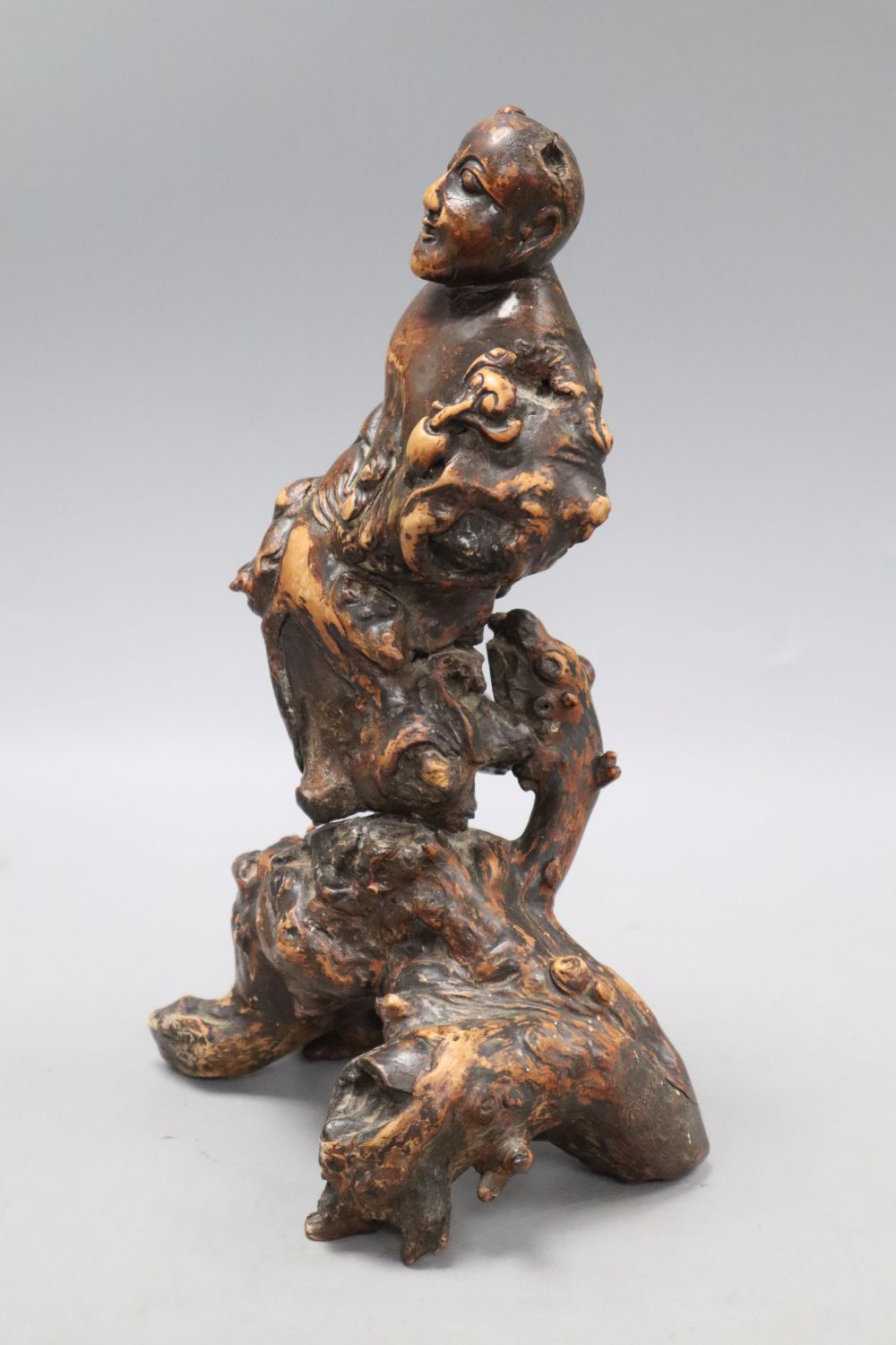 A Chinese rootwood carving of a deity, height 26cm